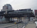 NS 1066 in profile above 2nd St. as 284 departs the yard